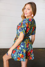 Load image into Gallery viewer, Navy Tropical Floral Surplice Romper