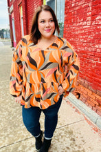 Load image into Gallery viewer, In My Thoughts Rust Abstract V Neck Peplum Top