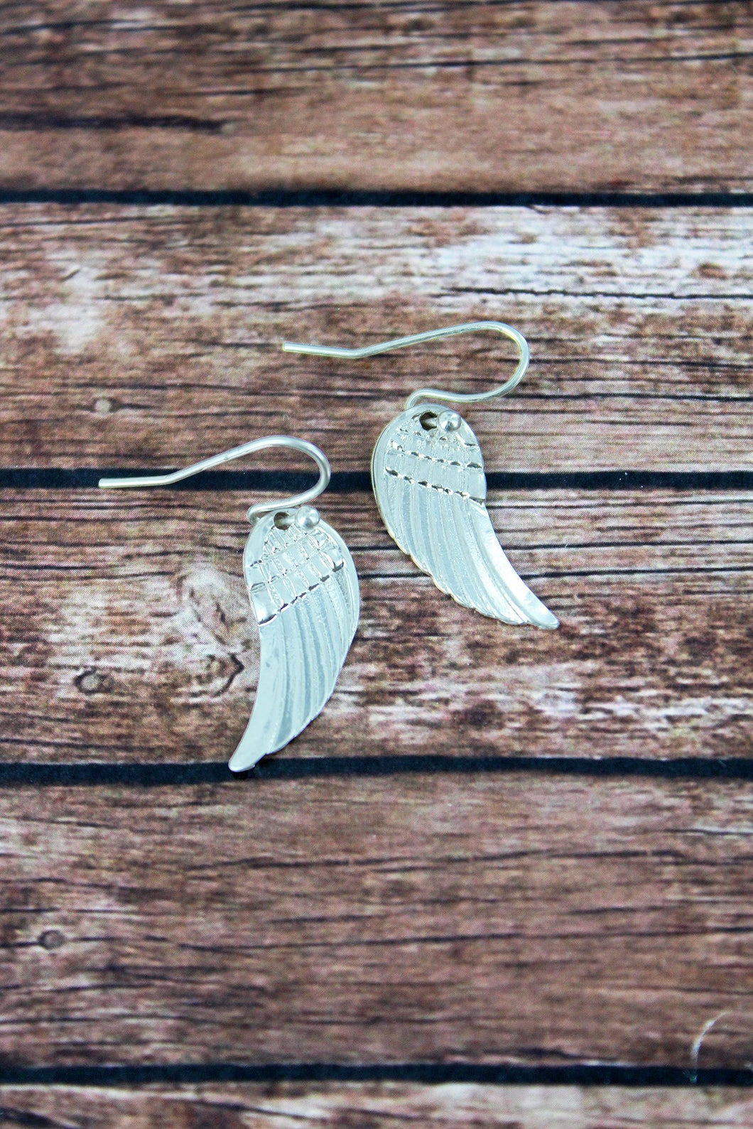 CRAVE WORN SILVERTONE WING EARRINGS - Unique Inspirations by Tracy and Anna