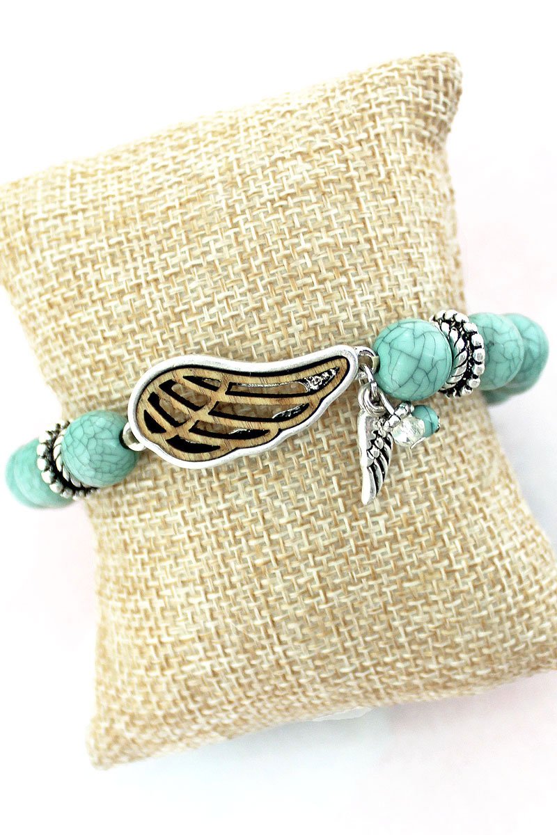 WORN SILVERTONE AND TURQUOISE WOODEN WING STRETCH BRACELET - Unique Inspirations by Tracy and Anna